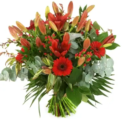 Kerstboeket van rode lelies en bloemen